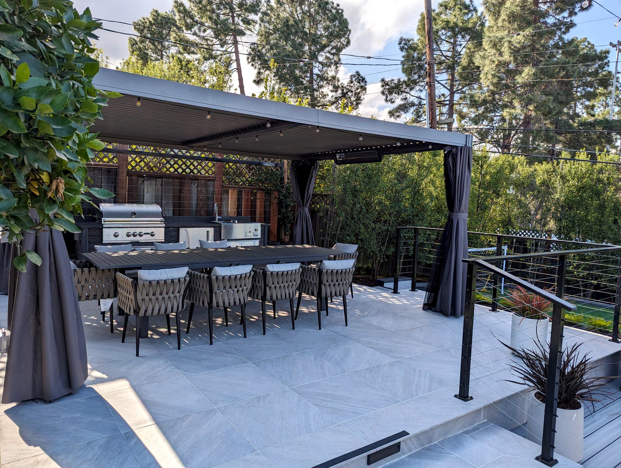 Porcelain paver, pergola, cable railing, outdoor kitchen